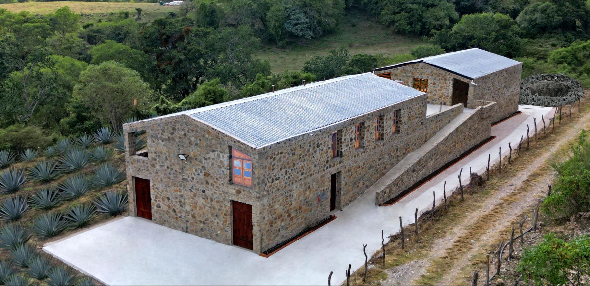 Aerial view of the Mezcal Argato distillery, built from natural stone hand-extracted from the property