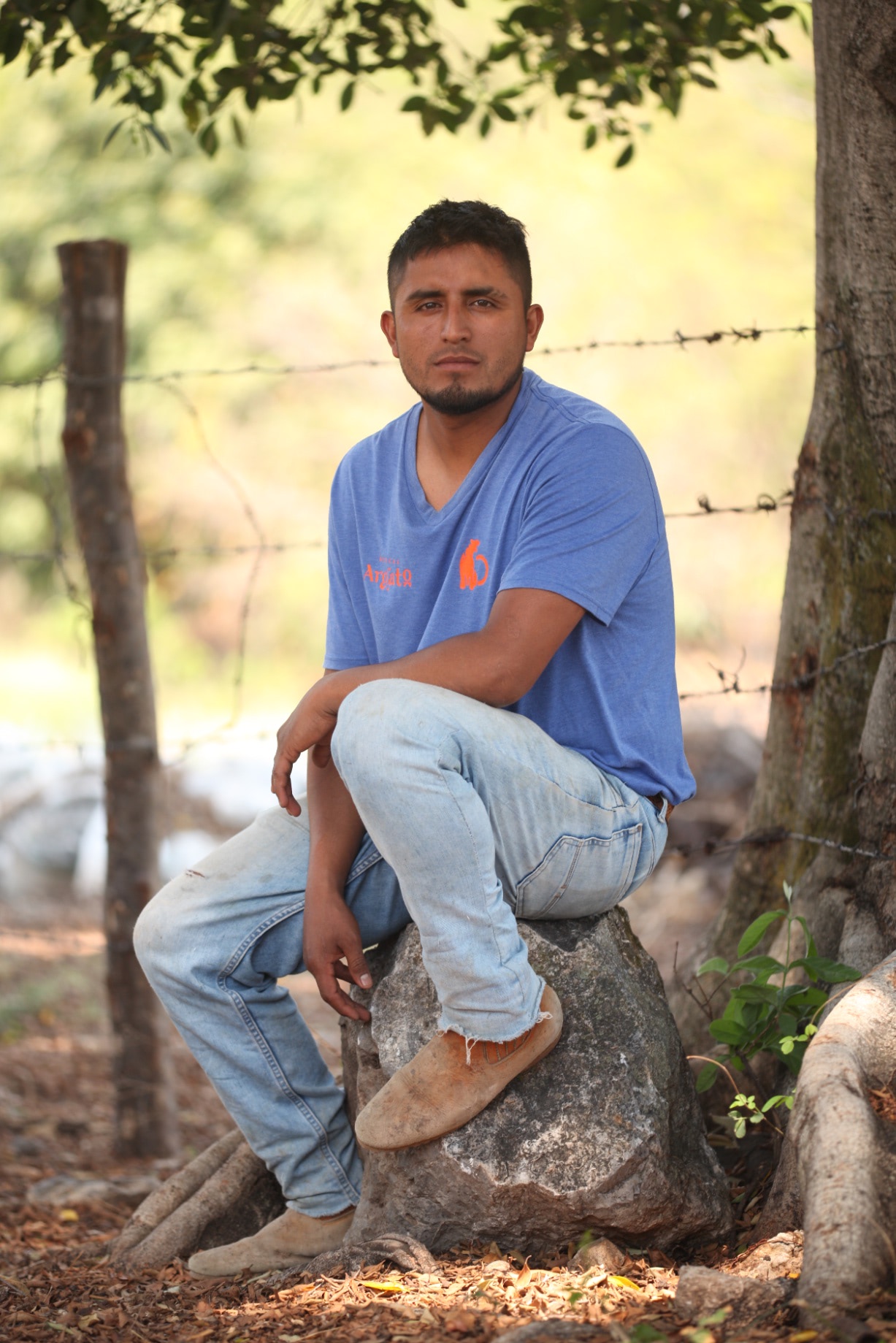 Mario Uribe Lopez, Master Mezcalero, in a blue Argato shirt on the estate
